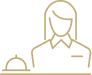 A stylized icon of a person sitting in a wheelchair next to a bed, representing accessible accommodations or wellness community suites.